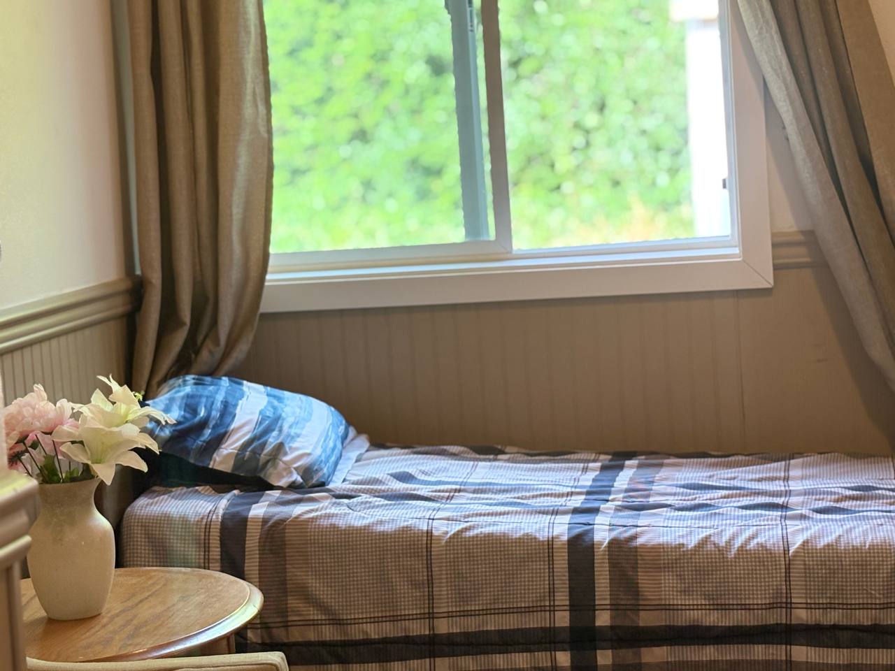 Caregiver helping resident with personalized daily care